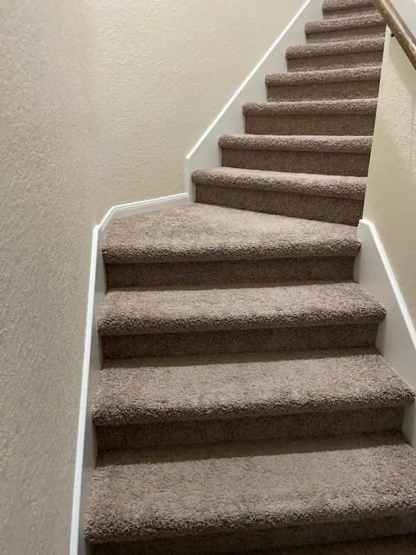 Carpet out, oak treads and white risers: Before